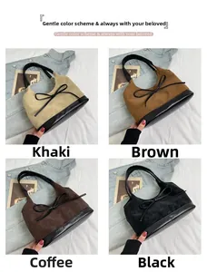 Detail of four retro bucket bags in khaki, brown, coffee, and black suede with bow accents