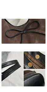 Detail of vintage suede bucket bag featuring black bow decoration and magnetic buckle closure