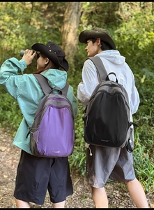 Outdoor leisure backpacks in purple and black colors with wide comfortable shoulder straps