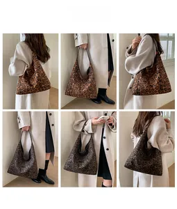 Detail view of large leopard print tote bags in light and dark brown fabric styles