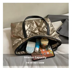 Macro shot showing large capacity of the quilted tote bag with tablet and daily items