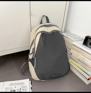 Detail of color-block backpack with BOGEWADE rubber logo on durable nylon material