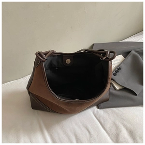 Top view of large suede tote bag interior showing magnetic buckle and spacious brown lining