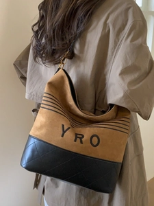 Large capacity bucket tote bag with letters and quilted faux leather finish