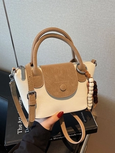 Elegant off-white and brown patchwork PU leather shoulder bag with beaded tassel charm