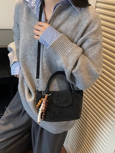 Classic black matte shoulder bag with wooden bead charm and top handle for women