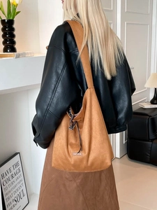 Brown faux suede large capacity tote bag with adjustable drawstring and our rave logo