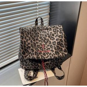 Leopard print backpack with red Take It Easy text and adjustable drawstring closure