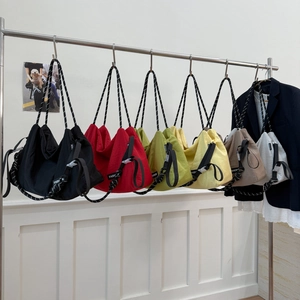 Detail of multi-color nylon tote bags with adjustable rope straps in six vibrant colors