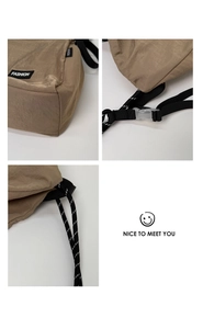 Close-up of brown nylon fabric texture, translucent buckle, and durable strap detail