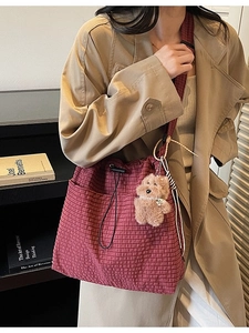 Red plaid fabric bucket bag with drawstring closure and cute teddy bear charm
