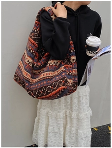 Detailed texture of thick plush tote bag with vintage ethnic geometric patterns