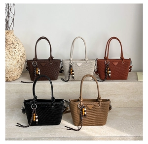 Detailed grid of pleated bucket bags in five retro colors on minimalist marble steps