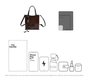 Detail showing high capacity of the vintage dark brown bucket bag for smartphone and essentials