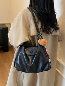 Retro black large capacity shoulder bag with plush bear charm and fashion embossing