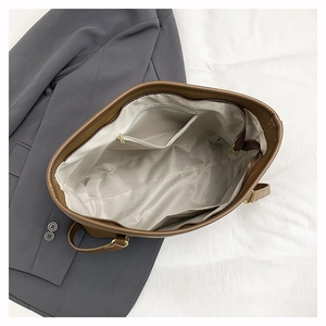 Top view of large brown pebble leather tote bag with inner zipped pocket and lining