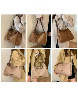 Detailed look at coffee and beige large tote bags with heart pendants and matte texture