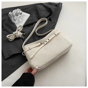 Detail of off-white pleated shoulder bag with metallic buckle and detachable PU straps