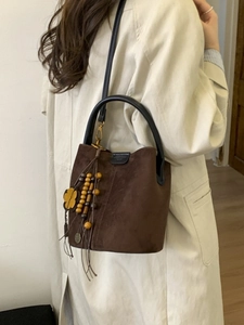 Vintage brown frosted bucket bag with round handles and floral charm for women