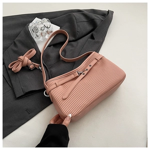 Detail of pink pleated leather bucket bag with adjustable straps and metal buckle