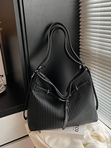Vintage black wrinkled leather tote bag with vertical pleats and shoulder straps