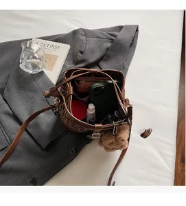 Top view of leopard print bucket bag interior showing large capacity for essentials