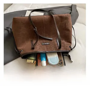 Spacious interior of leopard print faux suede tote bag showing everyday essentials storage