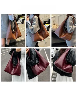 Outdoor street view of models wearing large brown and burgundy vintage shoulder bags