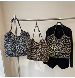 Detailed macro view of plush leopard print tote bags in grey, dark brown and light brown