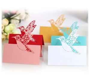 Laser cut bird place cards for wedding tables in assorted colors and patterns