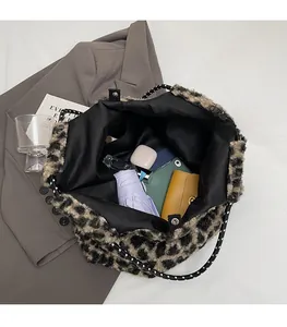 Detailed view of the leopard print tote bag interior showing large storage capacity