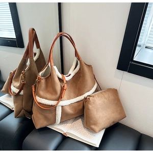 Detail of brown faux suede tote bag with white faux fur trim and matching pouch