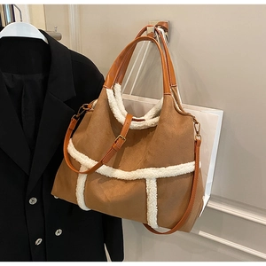 Detail of brown matte tote bag with plush fleece trim and adjustable strap
