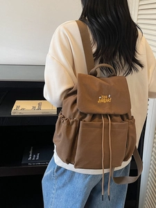 Minimalist large capacity brown canvas backpack with embroidered flip cover for travel