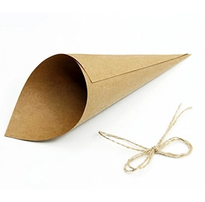 Macro view of a DIY kraft paper cone with a natural twine bow for wedding confetti use