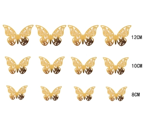Set mit 12 goldenen 3D-Hohl-Schmetterlings-Wandaufklebern in drei Größen auf Weiß