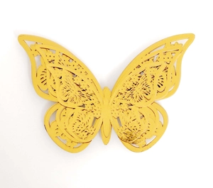 Macro detail of 3D gold butterfly wall sticker with intricate laser cut floral patterns