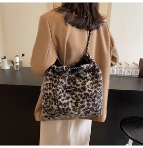 Detail of plush leopard print tote bag with Moonshine label and polka dot rope handle