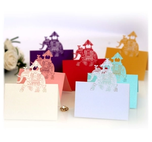 Laser-cut elephant place cards for weddings available in various colorful paper designs