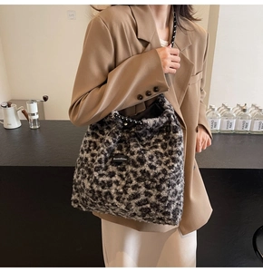 Chic leopard print plush tote bag with Moonshine label shown on a shoulder-strap model