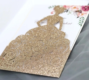 Detailed laser cut gold glitter wedding invitation featuring elegant female silhouette