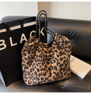 Detail of plush leopard print tote bag with soft faux fur texture and Moonshine label