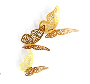 Golden 3D hollow butterfly wall stickers with intricate laser-cut floral patterns