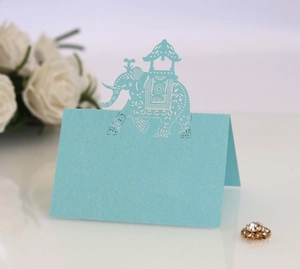 Light blue laser cut elephant place card for wedding table with intricate hollow design