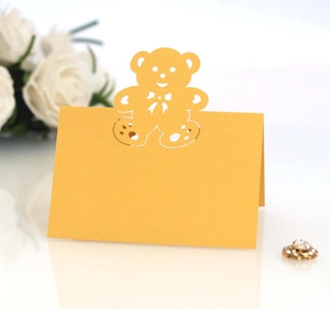 Laser-cut teddy bear place cards in ginger yellow for wedding and party table settings