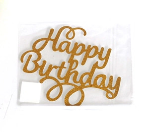 Close-up of golden glitter Happy Birthday cake topper in clear packaging