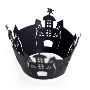Halloween black laser-cut cupcake wrappers with castle and skull motifs on white background
