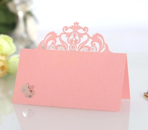 Pink laser-cut lace crown table seating card with silver floral pattern for weddings