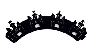 Detail of laser-cut black Halloween cupcake wrapper featuring a gothic castle and skulls