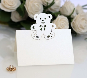 Laser-cut pearl white place card with teddy bear design for wedding table setting